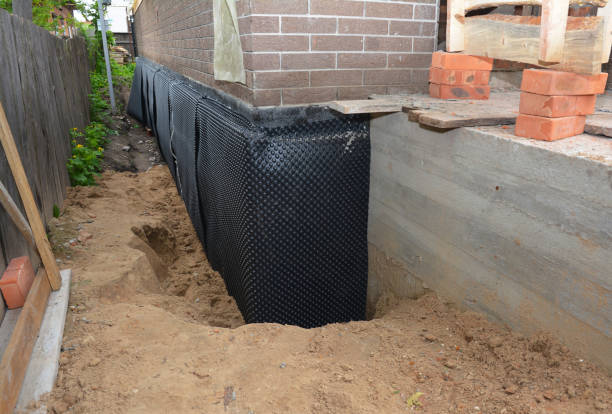Happy homeowners after waterproofing job in Greenlawn